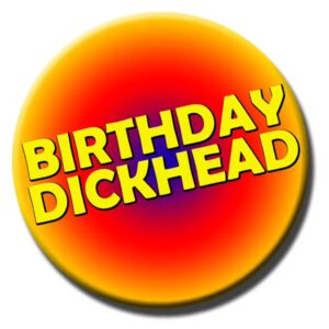 Orange and yellow gradient badge with the words ‘Birthday Dickhead’, a humorous gag gift