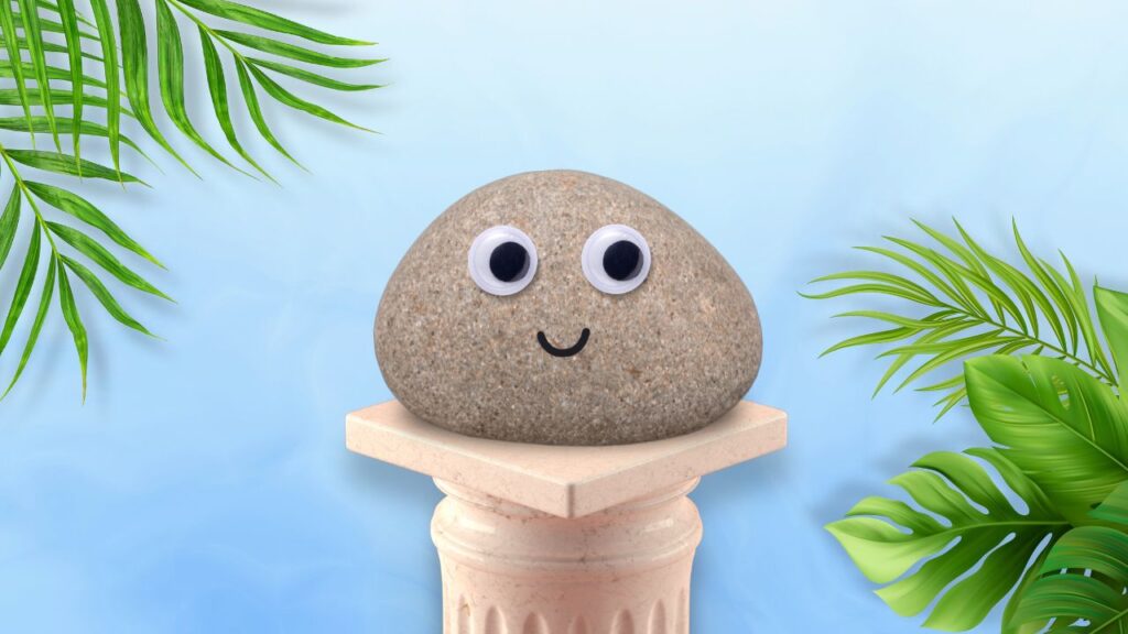 Pet Rock sat on a greek podium with green leaves surrounding it