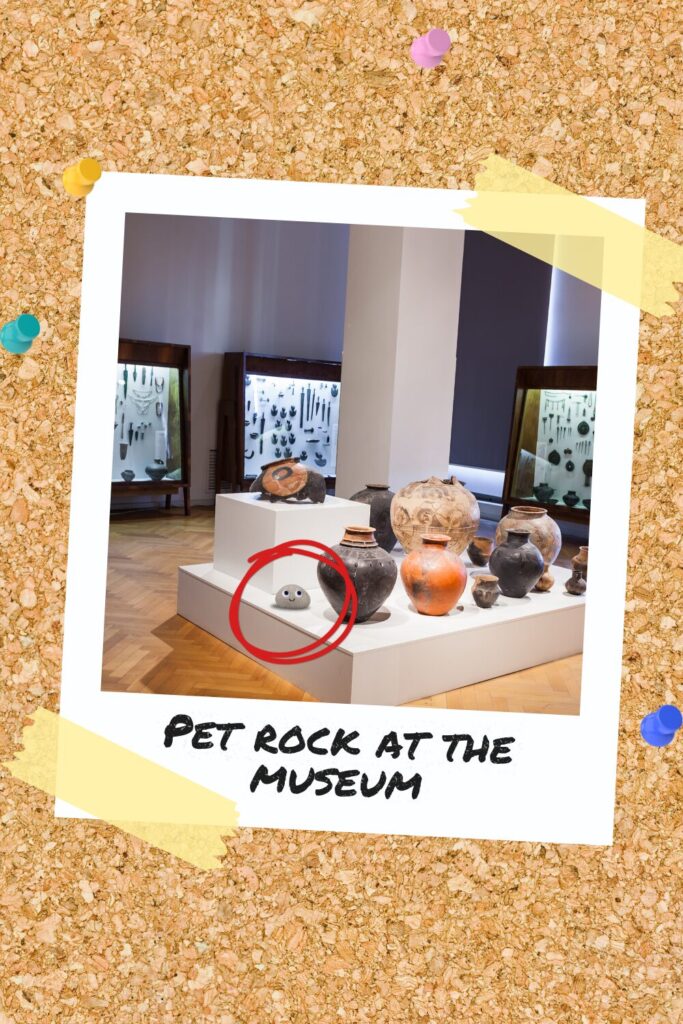 A pet rock with googly eyes placed among ancient artifacts in a museum exhibit.